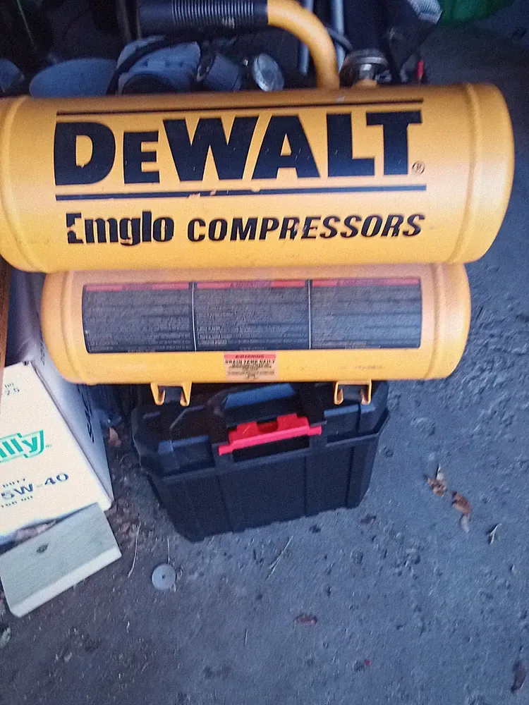 DEWALT Air Compressor And Nail Gun, Nails, And Air Hose.